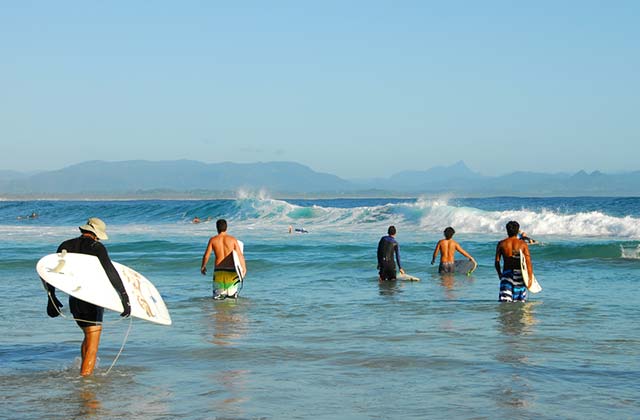 Surfers aiming for the next wave