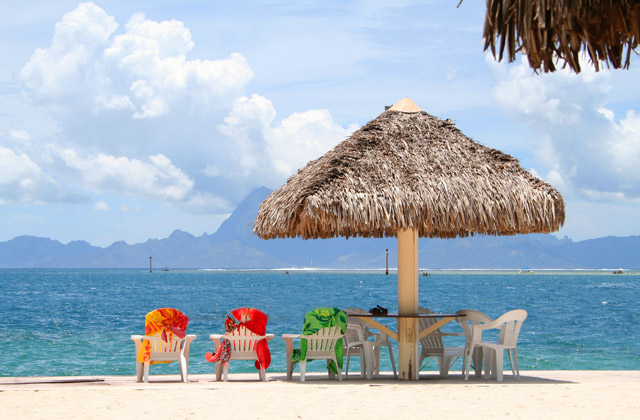 Relax under a thatch umbrella